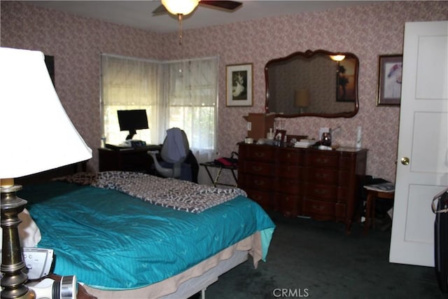 bedroom with carpet and wallpapered walls