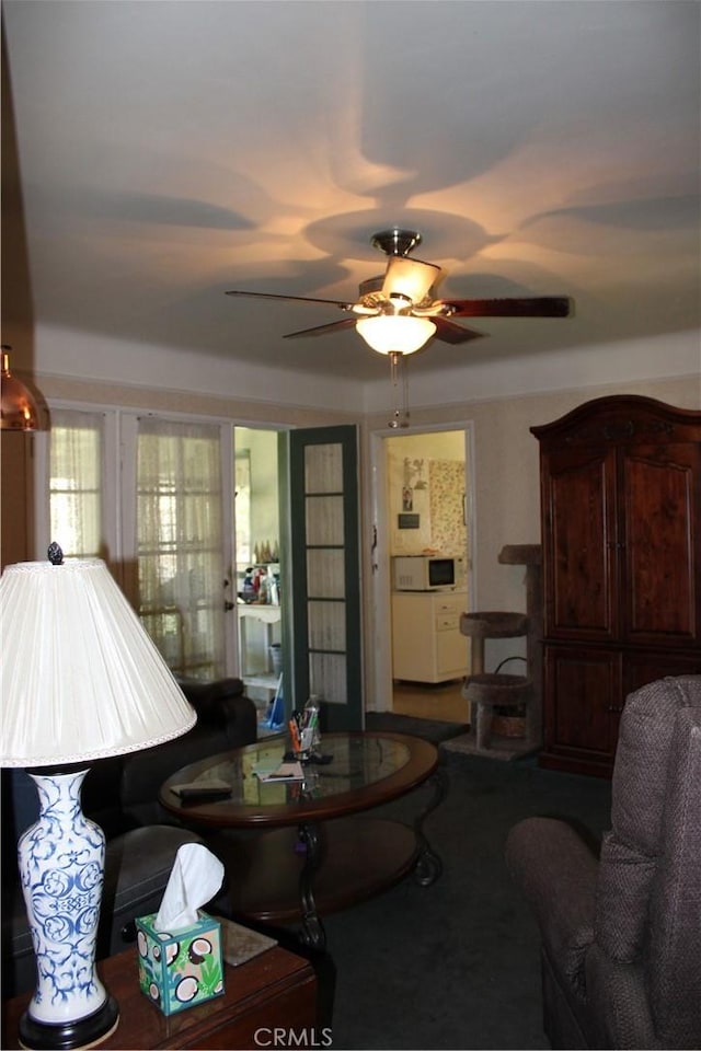 living room featuring ceiling fan