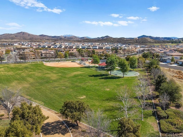 drone / aerial view featuring a residential view and a mountain view