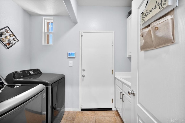 laundry area with cabinet space and independent washer and dryer