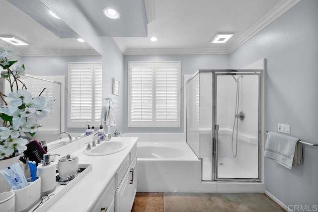 full bath with crown molding, a sink, and a shower stall