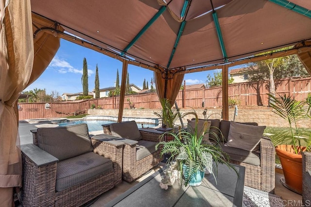 view of patio with a fenced in pool, a fenced backyard, a gazebo, and an outdoor hangout area