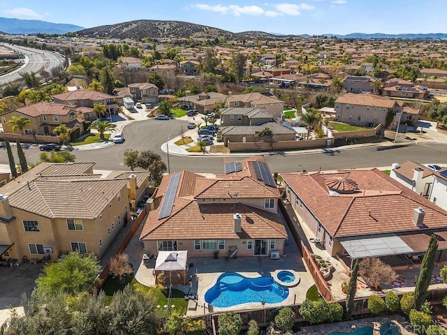 drone / aerial view featuring a residential view and a mountain view