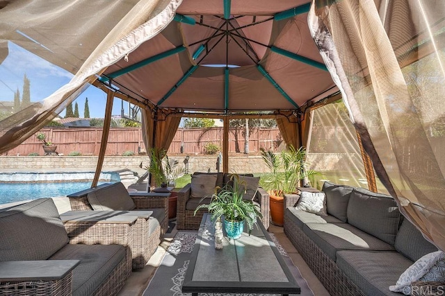 view of patio / terrace with a fenced backyard, outdoor lounge area, and a gazebo