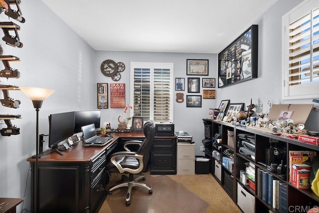 office area featuring light colored carpet