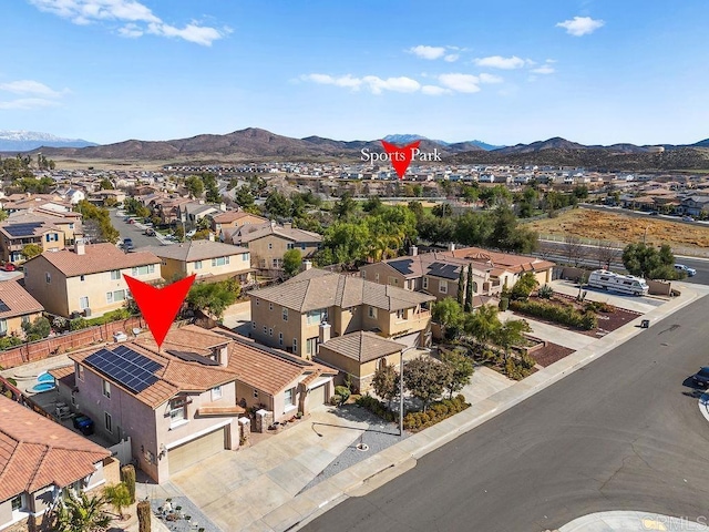 birds eye view of property with a residential view and a mountain view