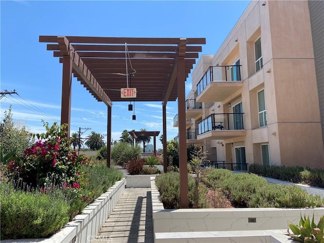 view of home's community featuring a pergola