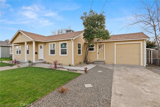 ranch-style house featuring entry steps, an attached garage, fence, concrete driveway, and a front lawn