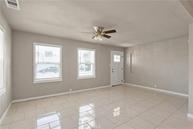 812 Toomes Ave, Corning, CA 96021 - foyer featuring light tile patterned floors, visible vents, baseboards, and ceiling fan