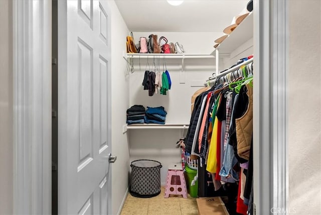 walk in closet featuring tile patterned flooring