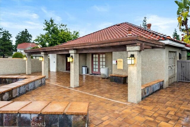 view of patio / terrace with fence and french doors