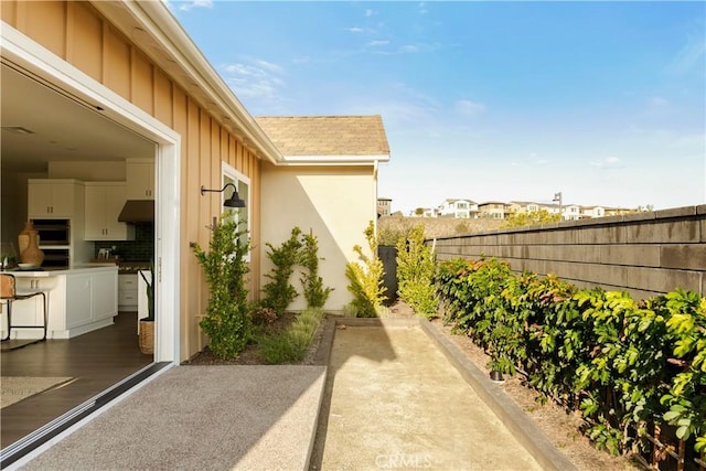 view of patio featuring fence