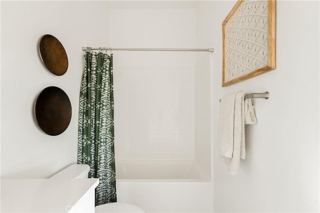 full bathroom featuring toilet and shower / bathtub combination with curtain