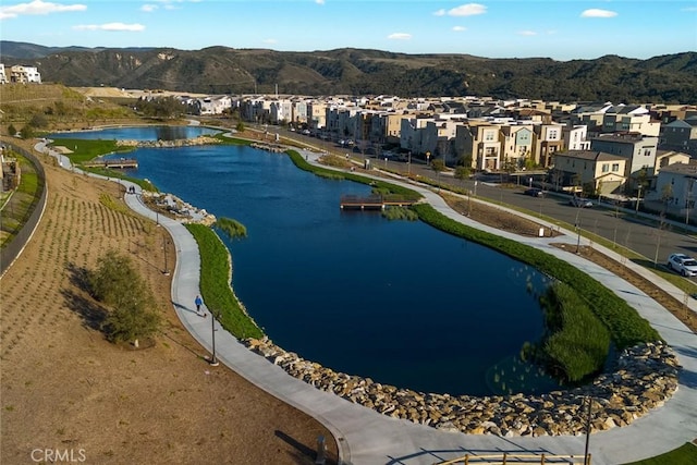 bird's eye view with a residential view and a water and mountain view