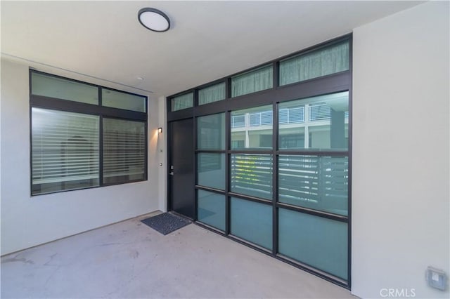 doorway to property with stucco siding