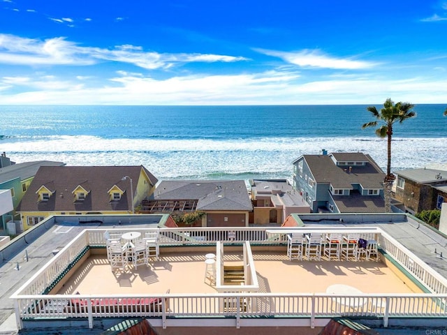 drone / aerial view with a view of the beach and a water view