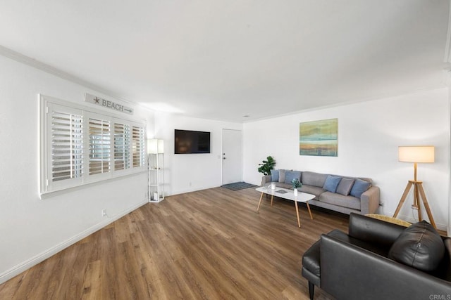 living area featuring wood finished floors and baseboards