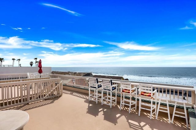 view of patio featuring a water view