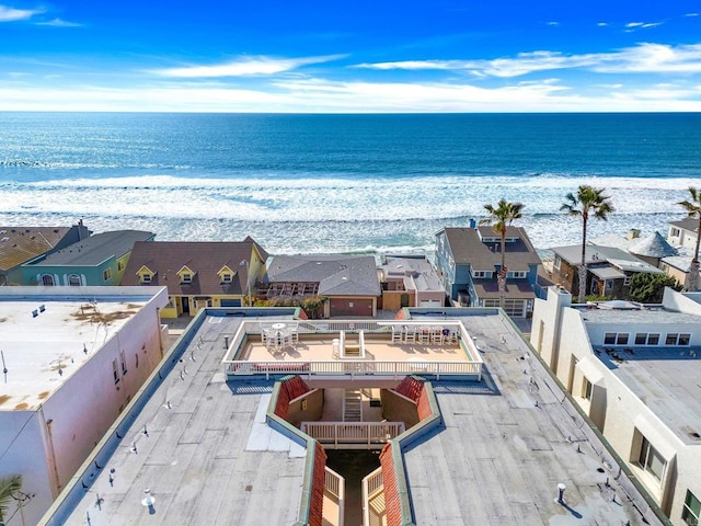 bird's eye view with a water view and a view of the beach