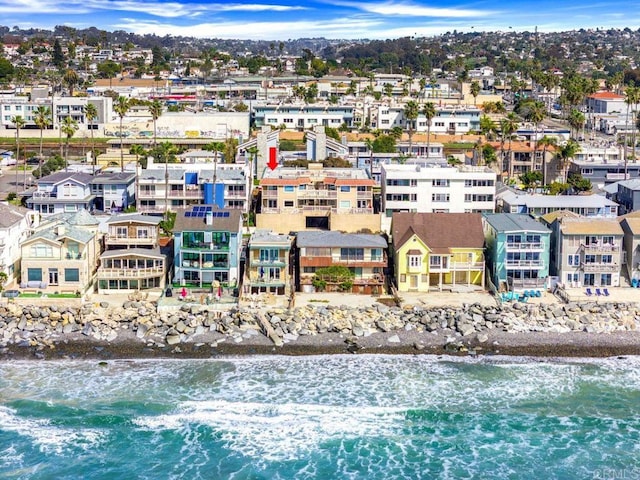 drone / aerial view featuring a water view and a residential view