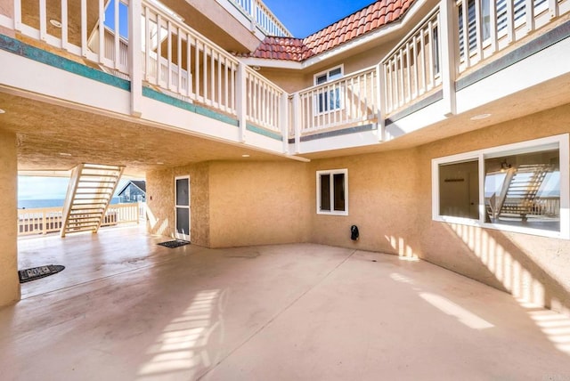view of patio featuring a balcony