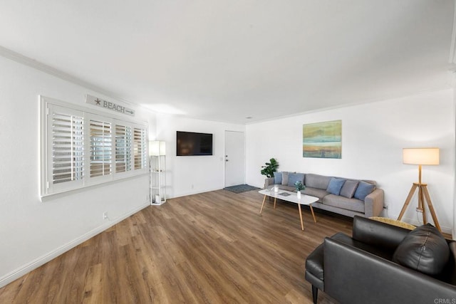 living room with wood finished floors and baseboards
