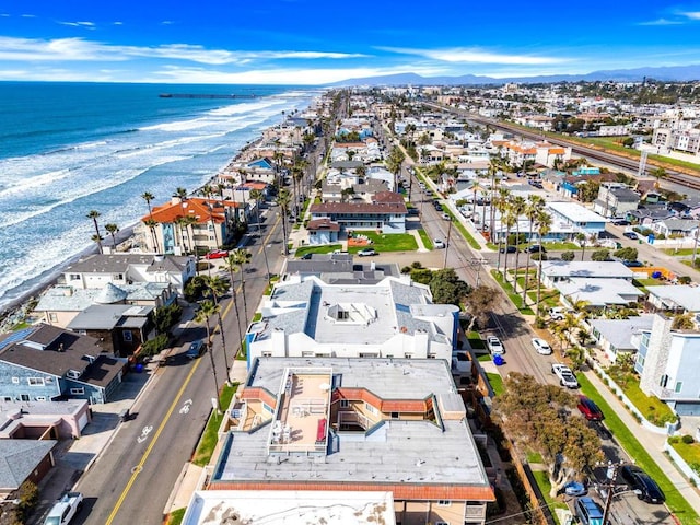 aerial view featuring a beach view, a residential view, and a water view