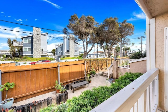 exterior space featuring fence and a residential view