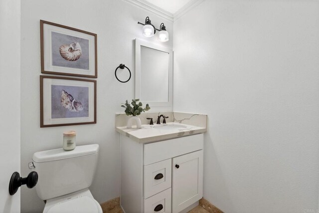 1118 S Pacific St Unit B, Oceanside, CA 92054 - half bathroom with vanity, crown molding, and toilet