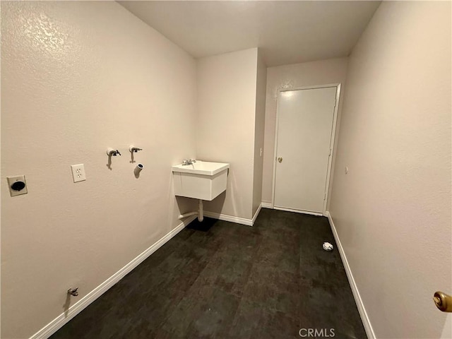 laundry room with laundry area, hookup for a gas dryer, and baseboards