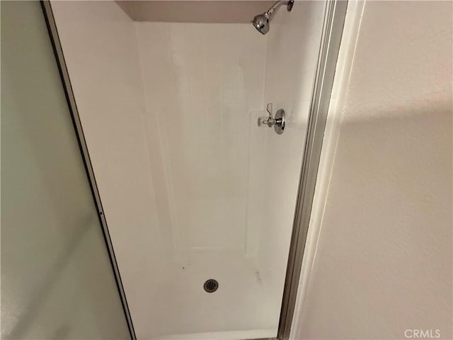 full bathroom with a shower stall