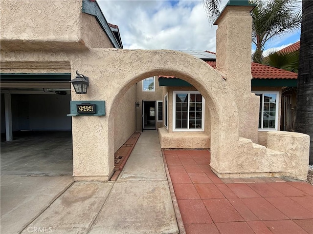 doorway to property with stucco siding