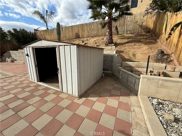 view of shed with a fenced backyard