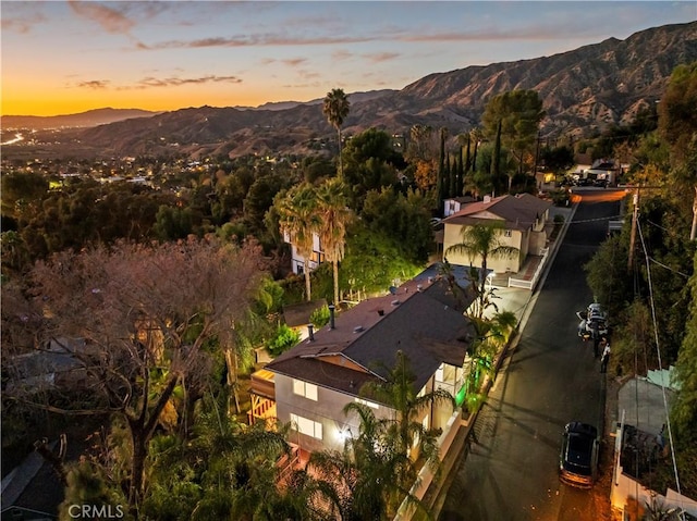 aerial view at dusk with a mountain view