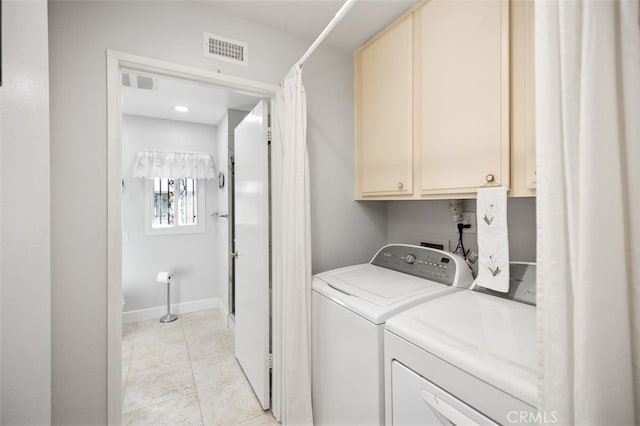 laundry room featuring cabinet space, visible vents, baseboards, independent washer and dryer, and light tile patterned flooring