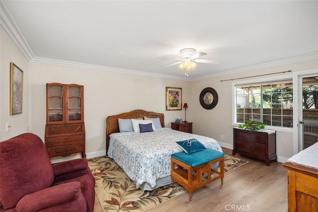 bedroom with light wood-type flooring, baseboards, and crown molding