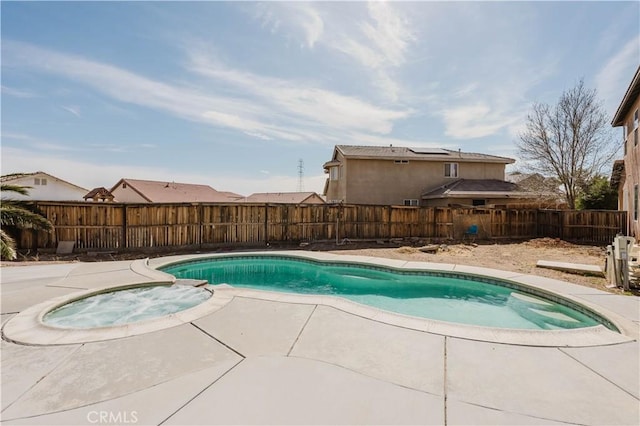 view of swimming pool featuring an in ground hot tub, a patio, a fenced backyard, and a fenced in pool