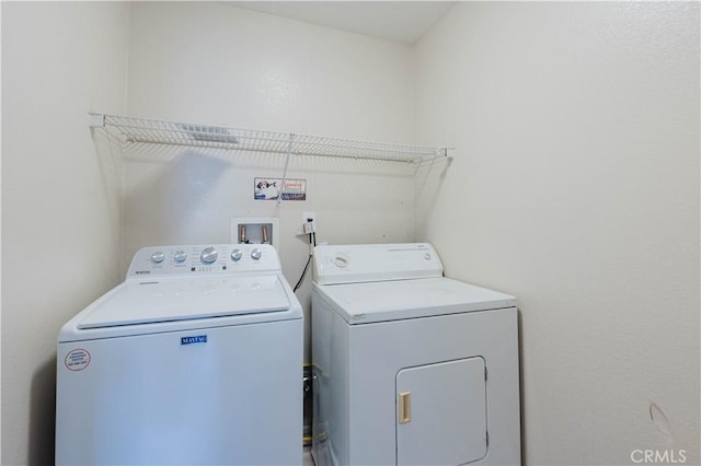 clothes washing area with laundry area and independent washer and dryer