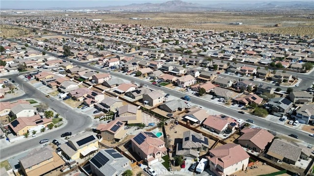 birds eye view of property with a residential view and a mountain view