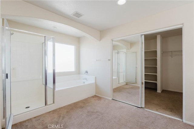 full bathroom featuring carpet floors, visible vents, and a shower stall