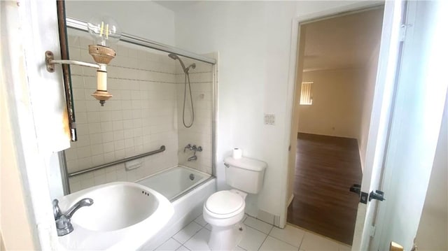 full bathroom with toilet, bathtub / shower combination, and tile patterned floors