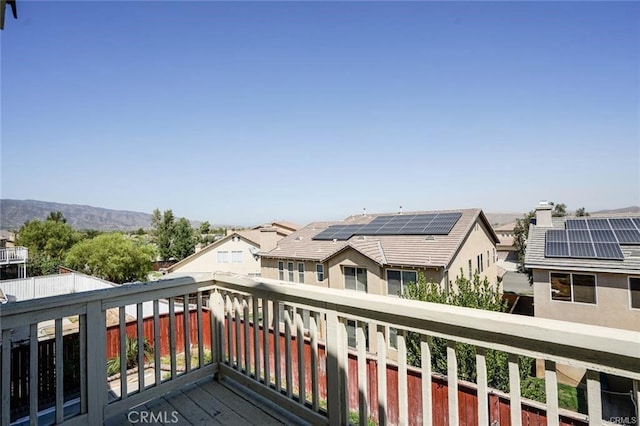 deck featuring a mountain view and a residential view