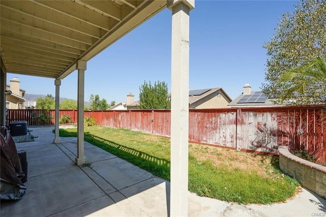 view of patio featuring a fenced backyard and central AC