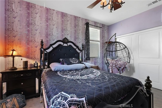 bedroom featuring ceiling fan and visible vents