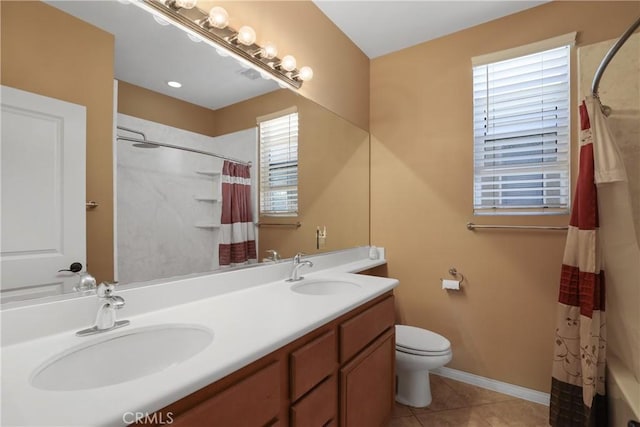 bathroom featuring tile patterned flooring, a sink, toilet, and a shower with curtain