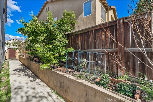 view of home's exterior featuring fence and stucco siding