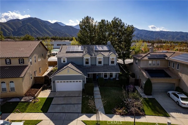 drone / aerial view featuring a residential view and a mountain view