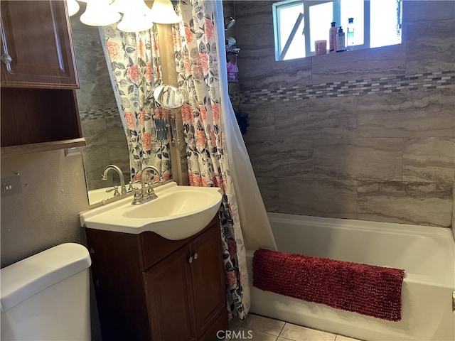 full bathroom featuring toilet, tile patterned floors, shower / bathtub combination with curtain, and vanity