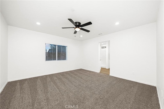 carpeted empty room with ceiling fan, baseboards, and recessed lighting