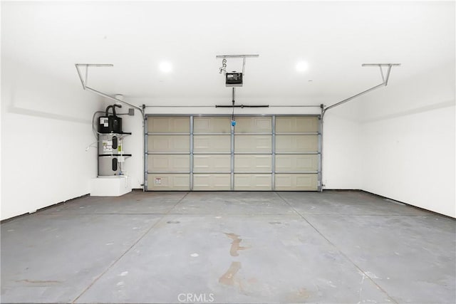 garage with hybrid water heater and a garage door opener